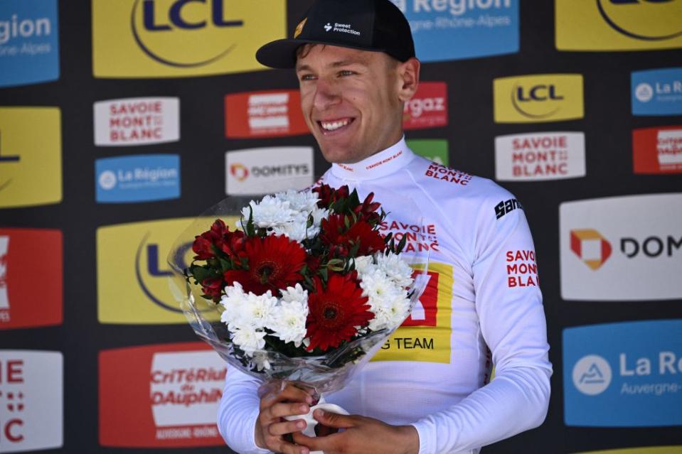 UnoX Cycling teams Norwegian rider Tobias Halland Johannessen celebrates his white jersey of best young on the podium after the seventh stage of the 74th edition of the Criterium du Dauphine cycling race 135kms between SaintChaffrey to Vaujany southeastern France on June 11 2022 Photo by Marco BERTORELLO  AFP Photo by MARCO BERTORELLOAFP via Getty Images