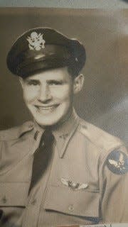 Ewing H. Miller, a B-24 heavy bomber pilot assigned to the 15th Air Force, 449th Bomb Group of the 719 Squadron, poses in his military uniform during his deployment in World War II.