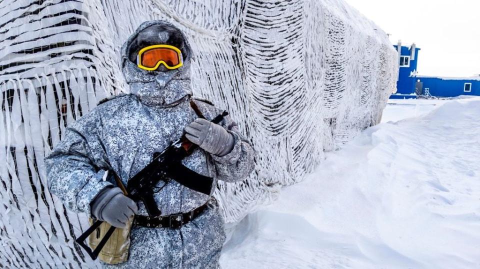 TOPSHOT - A soldier holds a machine gun as he patrols Russia's Northern Military Base on Kotelny Island, outside the Arctic Circle, on April 3, 2019.  - The Russian military base, also called the 