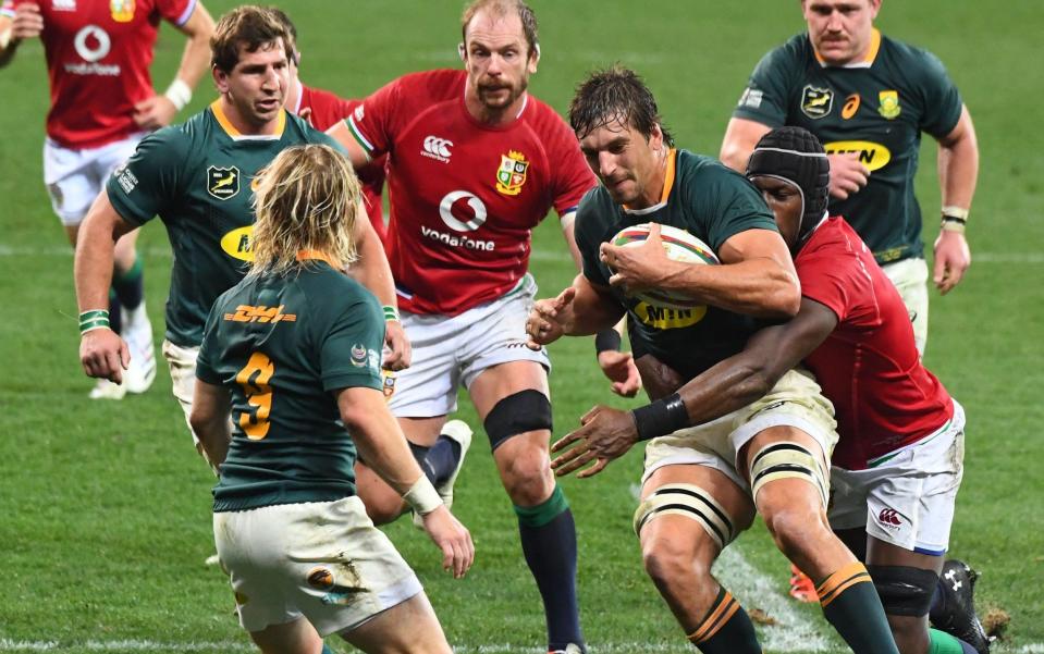 South Africa's lock Eben Etzebeth is tackled during the second rugby union Test match between South Africa and the British and Irish Lions at The Cape Town Stadium in Cape Town on July 31, 2021. - GETTY IMAGES