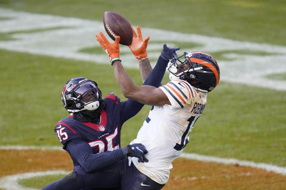 Houston Texans' Keion Crossen (35) breaks up a pass intended by Chicago Bears' Allen Robinson (12) during the second half of an NFL football game, Sunday, Dec. 13, 2020, in Chicago. (AP Photo/Charles Rex Arbogast)