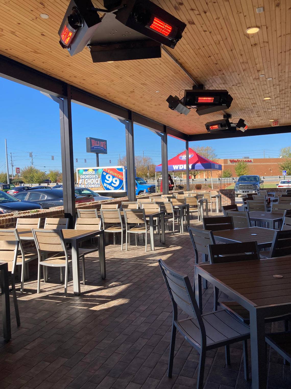 The covered patio at the new Walk-On’s Sports Bistreaux in Warner Robins can seat 50 people and has overhead warmers for the winter that double as air conditioners in the summer.