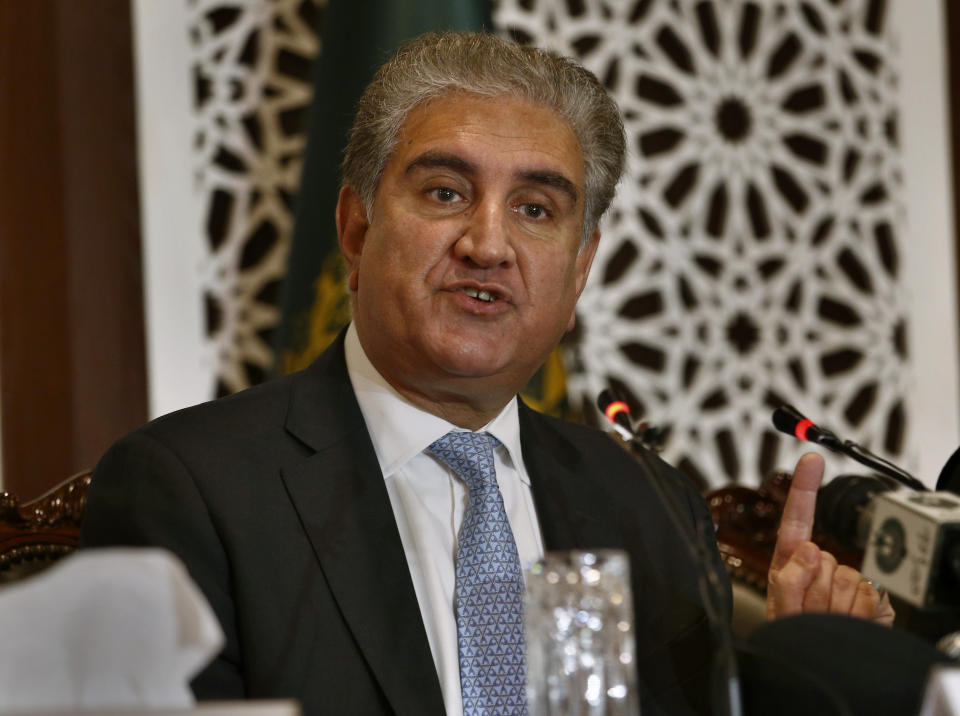 Pakistan's Foreign Minister Shah Mahmood Qureshi gestures during a press conference in Islamabad, Pakistan, Saturday, Aug. 10, 2019. Pakistan says that with the support of China, it will take up India's unilateral actions in the disputed region of Kashmir with the U.N. Security Council and may approach the U.N. Human Rights Commission over what it says is the "genocide" of the Kashmiri people. (AP Photo/Anjum Naveed)