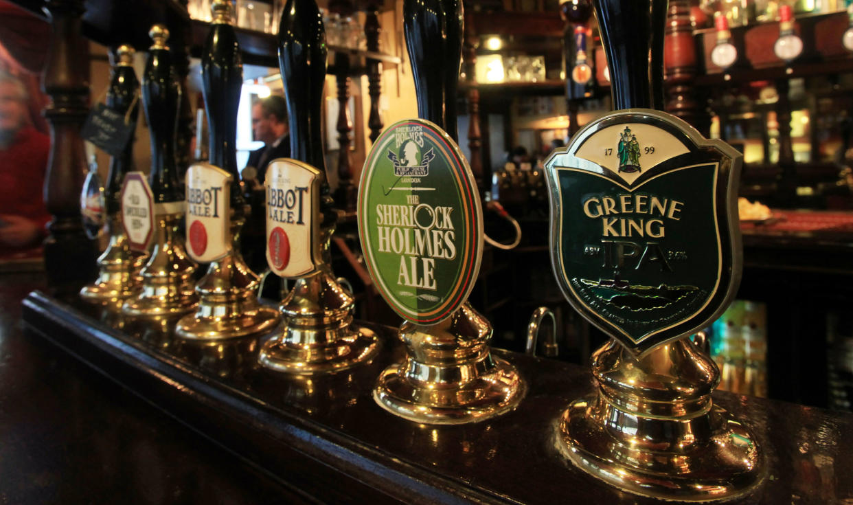 A selection of beers on draught at the bar of The Sherlock Holmes pub in central London, operated by pub and brewing company Greene King. 