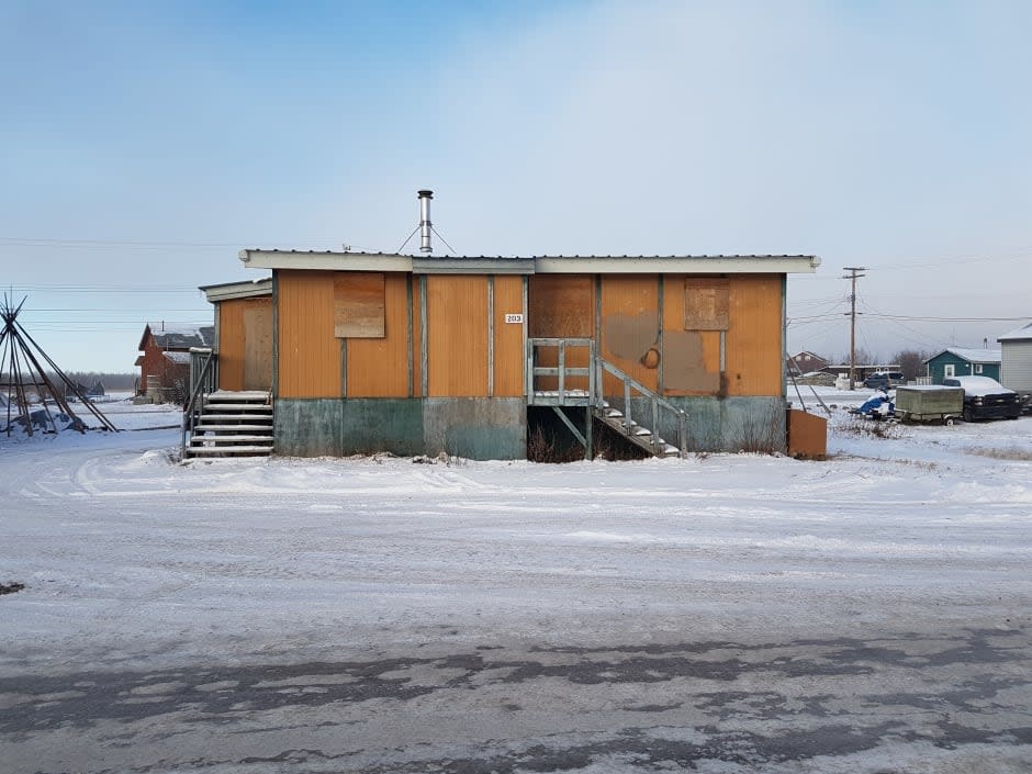 A boarded-up public housing unit in Behchoko, N.W.T. MLAs voted Wednesday in favour of making housing a fundamental right in N.W.T., bringing it in line with national and international law. (Curtis Mandeville/CBC - image credit)