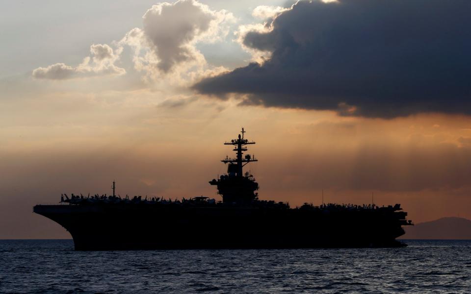 The USS Theodore Roosevelt is anchored off Guam - Bullit Marquez/AP