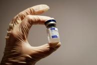 FILE PHOTO: A medical specialist holds a vial of Sputnik V vaccine against the coronavirus in a department store in Moscow, Russia