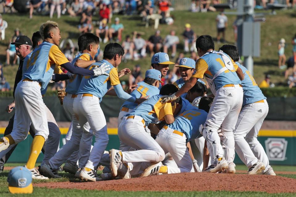 Players from the West Region team from Honolulu, Hawaii celebrate winning 13-3 against the Caribbean Region team from Willemstad, Curacao at Little League International Complex on August 28, 2022 in South Williamsport, Pennsylvania.