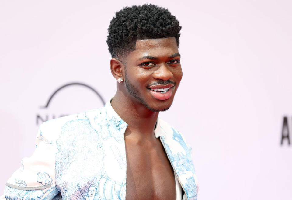 A closeup of Lil Nas X smiling