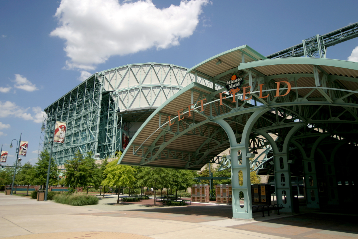 Exterior of Minute Maid Park, Houston, home of the Houston Astros empty with trees and walking area