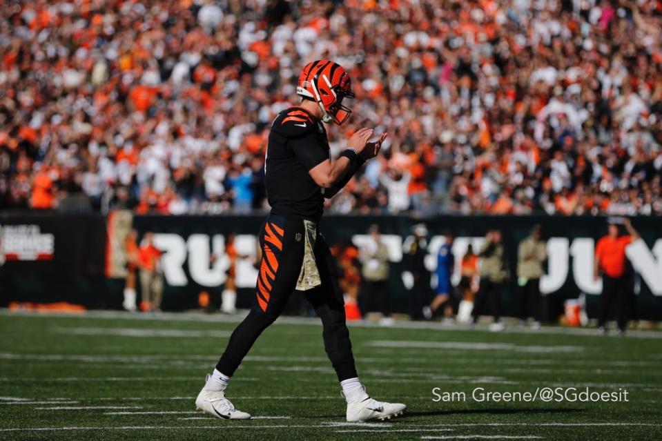 Cincinnati Bengals quarterback Joe Burrow applauds during the first quarter of Sunday's game against the Cleveland Browns at Paul Brown Stadium.