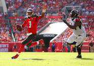 <p>Jameis Winston #3 of the Tampa Bay Buccaneers runs past Tyson Jackson #94 of the Atlanta Falcons for a touchdown during the first quarter of the game at Raymond James Stadium on December 6, 2015 in Tampa, Florida. (Photo by Rob Foldy/Getty Images) </p>