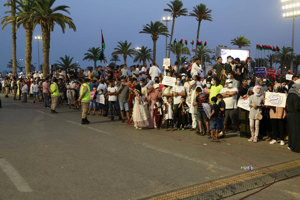 Hundreds of demonstrators protest in Tripoli, Libya, on Friday, Sept. 24, 2021, in opposition to the country’s parliament passing a vote of no-confidence in the transitional government. The motion, passed on Tuesday, represents a challenge to planned December elections and impedes efforts to unite the oil-rich North African nation after a decade of turmoil. (AP Photo/Yousef Murad)