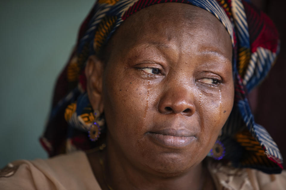 Mariam Bangoura, mother of the late Ousmane Sylla who died in Italy on Feb. 4, 2024, cries as she recounts memories of him at their house at Matoto Bonagui, a suburb of Conakry, Guinea, Monday, April 8, 2024. (AP Photo/Misper Apawu)