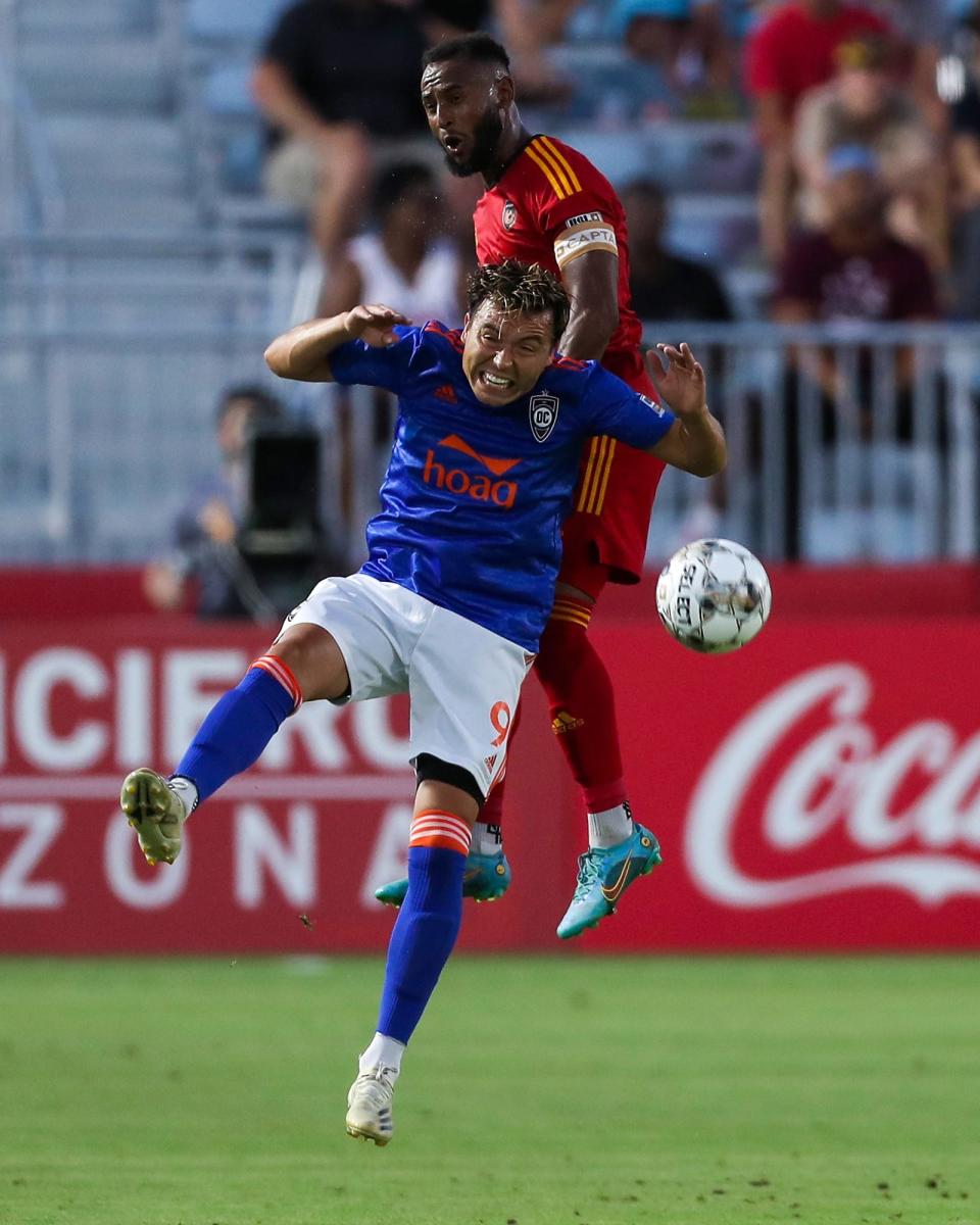 Phoenix Rising FC defender Darnell King (2), top, wins a header over Orange County SC forward Erick Torres (9), bottom, during the first half against Orange County SC on Saturday, July 2, 2022, in Chandler.