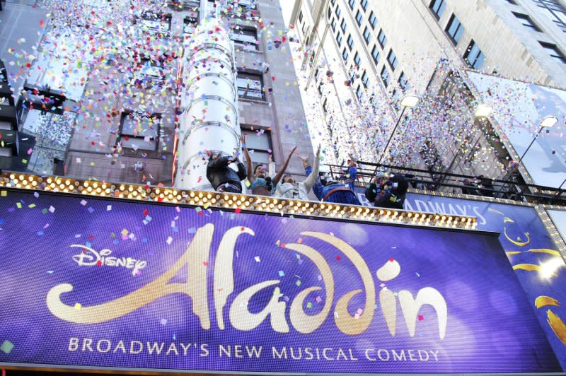 The cast of "Aladdin" on Broadway and event organizers toss confetti from the New Amsterdam Theatre Marquee for the annual New Year's Eve confetti test in New York City in 2014. File Photo by John Angelillo/UPI