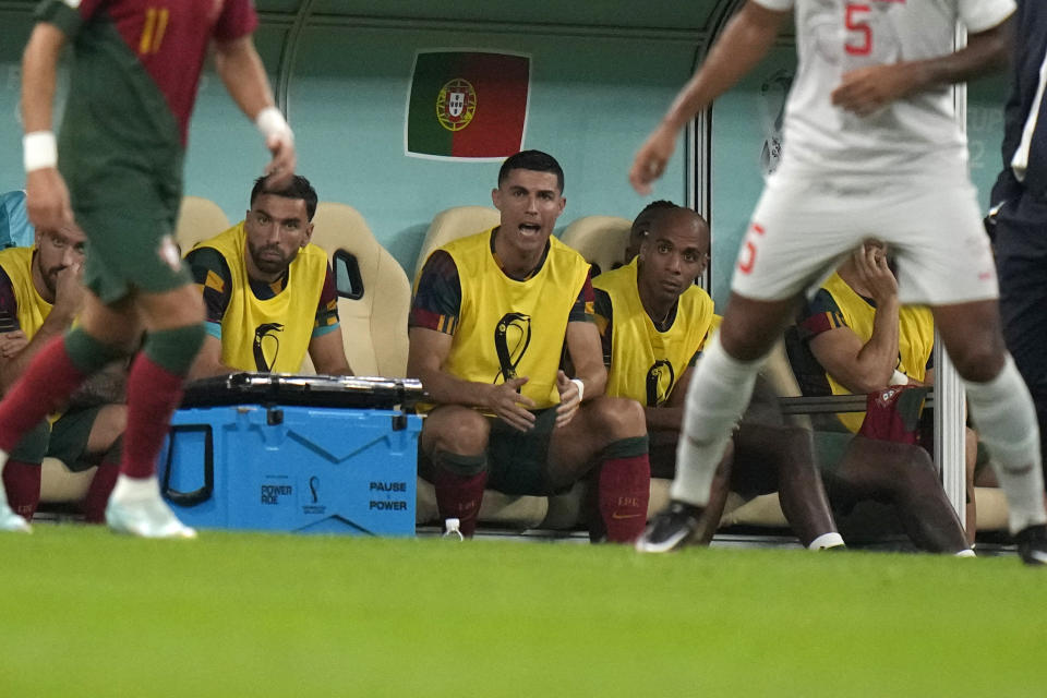 Portugal's Cristiano Ronaldo, third from right, sits on the bench during the World Cup round of 16 soccer match between Portugal and Switzerland, at the Lusail Stadium in Lusail, Qatar, Tuesday, Dec. 6, 2022. (AP Photo/Alessandra Tarantino)