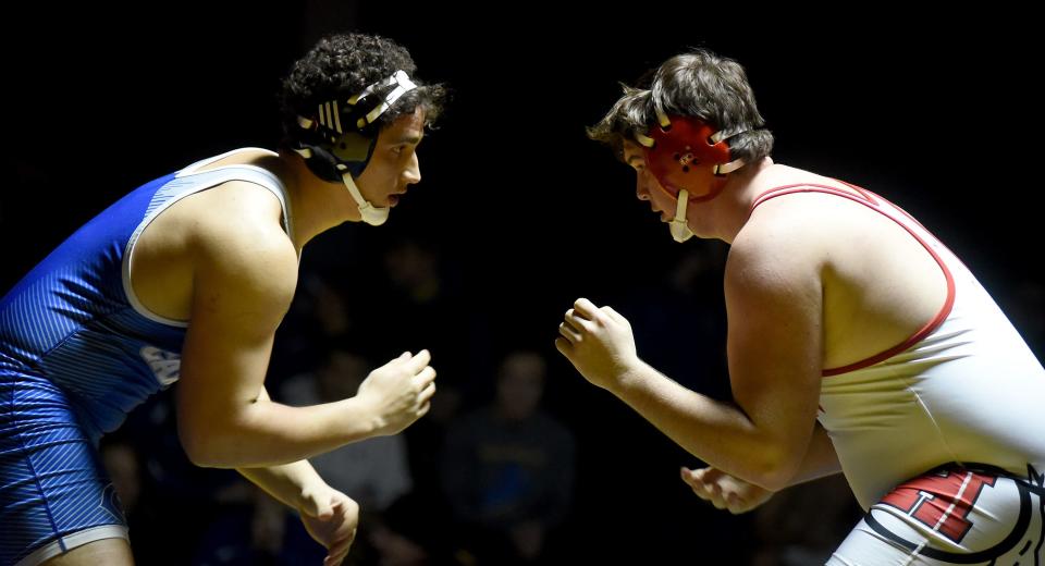 Ben Przytula of Gibraltar Carlson faces off with New Boston Huron's Josh Buettner in the 285-pound finals at the Monroe County Sheriff's Invitational.