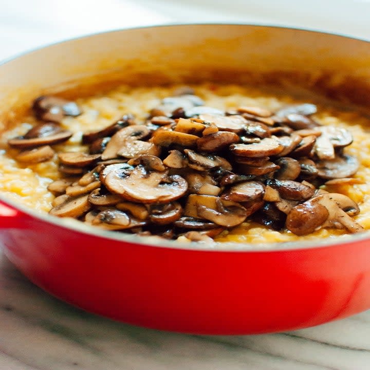 A Dutch oven filled with mushroom rice risotto.
