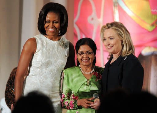 US First Lady Michelle Obama (left) and Secretary of State Hillary Clinton pose with Aneesa Ahmed of Maldives as she receives the 2012 International Women of Courage Award in Washington in March. A Maldives court has ordered the flogging of a girl, 16, who confessed to pre-marital sex in a ruling that Tuesday triggered wide criticism. The UN has said the Maldives must do more to protect women