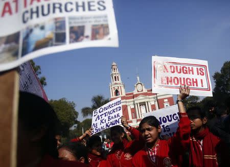 Demonstrators shout slogans as they hold placards during a protest outside a church in New Delhi February 5, 2015. REUTERS/Anindito Mukherjee