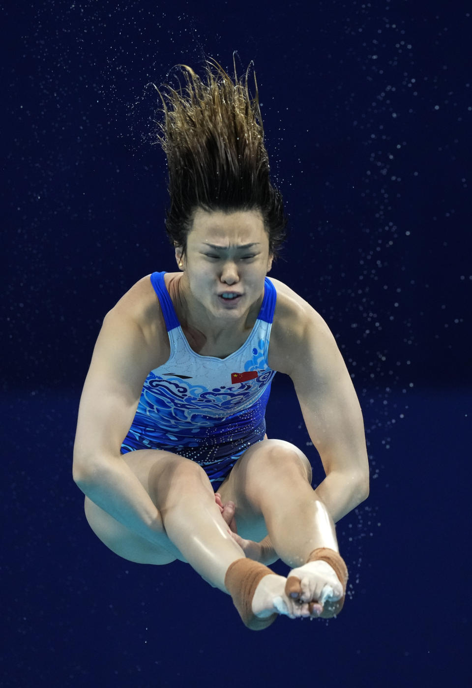 Shi Tingmao of China competes in women's diving 3m springboard preliminary at the Tokyo Aquatics Centre at the 2020 Summer Olympics, Friday, July 30, 2021, in Tokyo, Japan. (AP Photo/Dmitri Lovetsky)