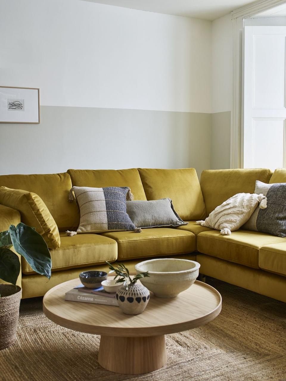 living room with mustard yellow sofa