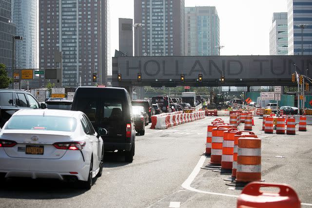 <p>Michael Nagle/Bloomberg via Getty</p> Vehicles approach the Holland Tunnel in Jersey City, New Jersey