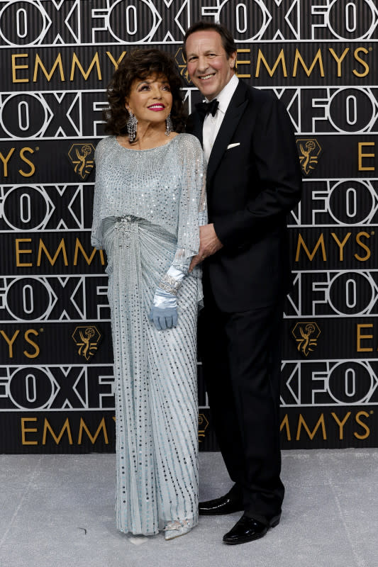 LOS ANGELES, CALIFORNIA - JANUARY 15: (L-R) Dame Joan Collins and Percy Gibson attend the 75th Primetime Emmy Awards at Peacock Theater on January 15, 2024 in Los Angeles, California. (Photo by Frazer Harrison/Getty Images)<p>Frazer Harrison/Getty Images</p>