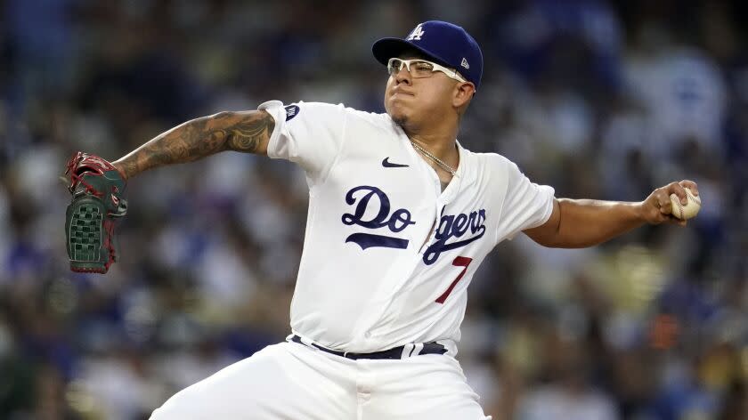 Los Angeles Dodgers starting pitcher Julio Urias throws to a San Diego Padres batter.