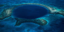 <b>Blue Hole, Belize </b> This beautiful natural phenomenon can easily distract even an experienced diver into going beyond acceptable depths following the sheer drop offs in crystal clear water.