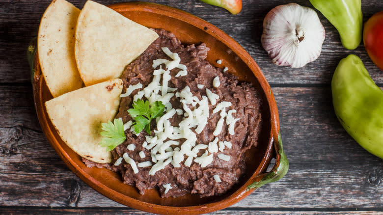 Bowl of refried beans with chips