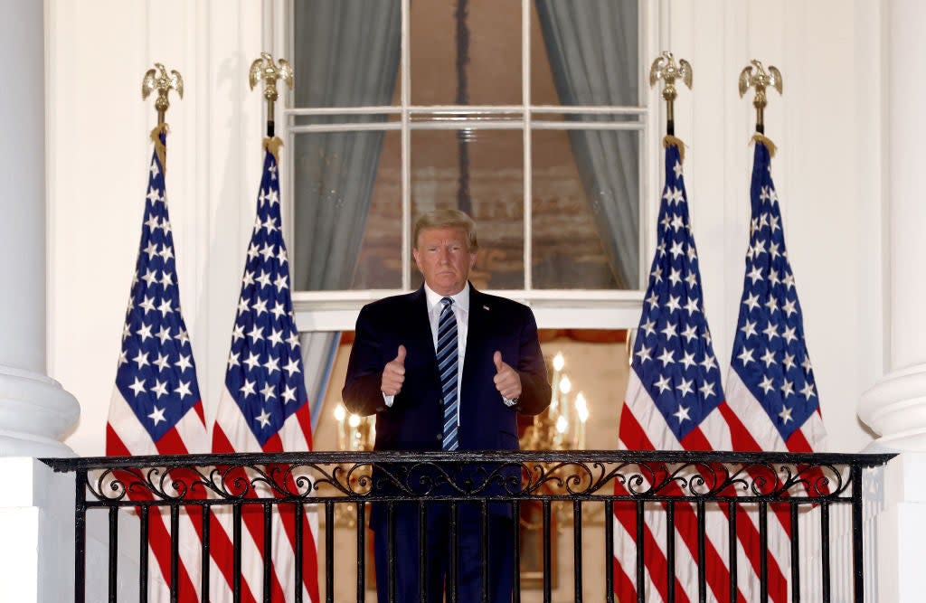 President waves to the cameras from Truman balcony (Getty Images)