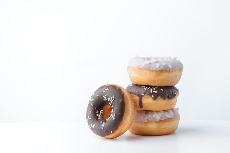 donuts with white and dark chocolate on a white background