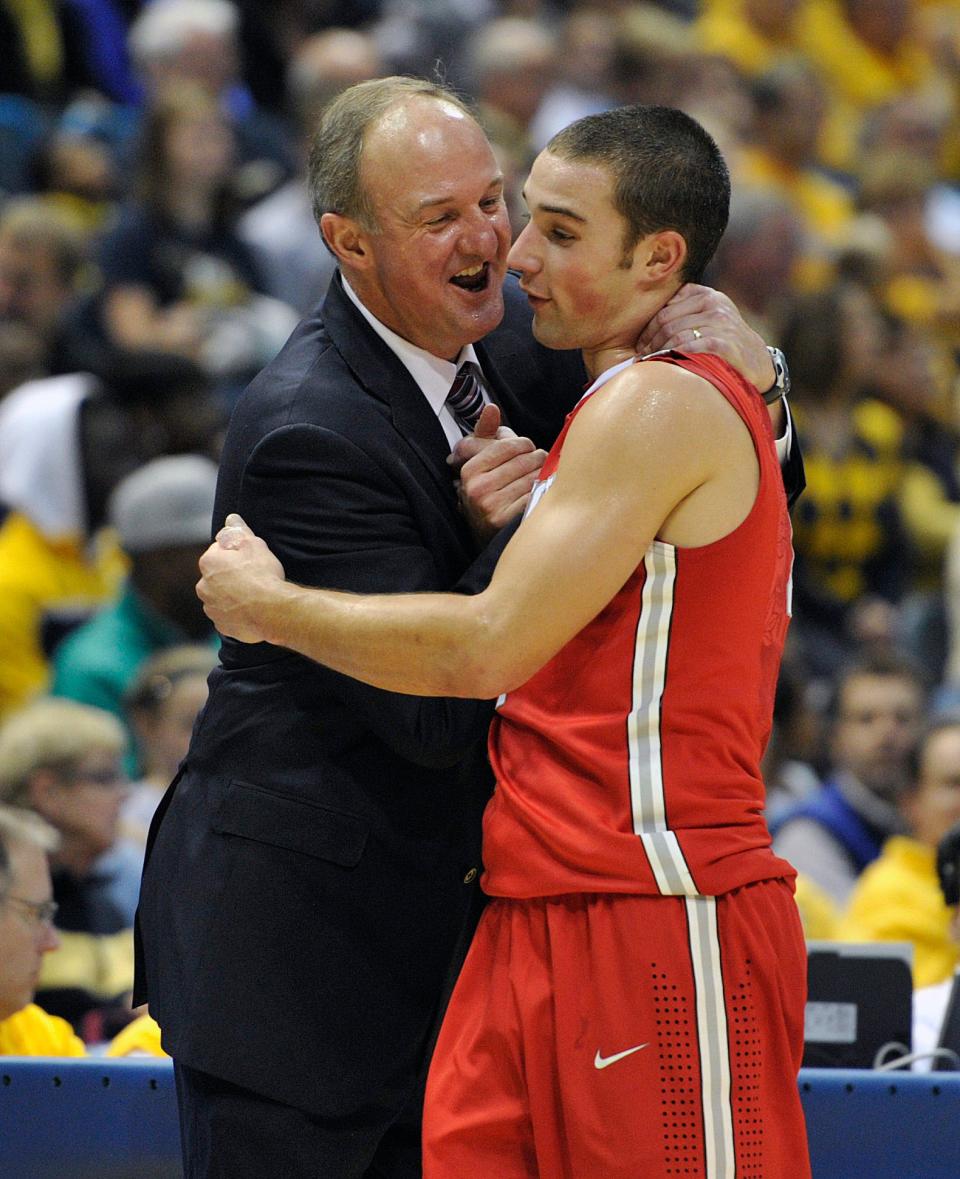 Ohio State coach Thad Matta, left, smiles as he hugs Aaron Craft, Nov. 16, 2013, in Milwaukee, during a Buckeyes' win over Marquette.