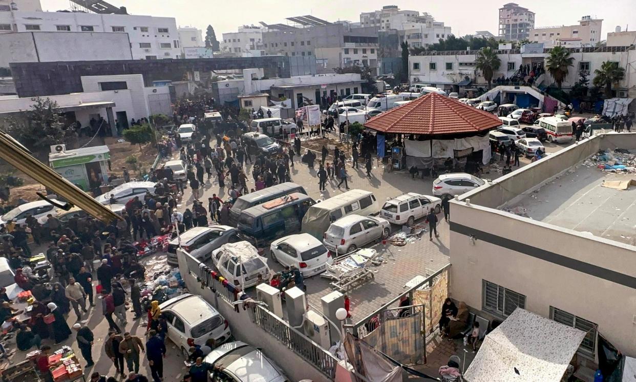 <span>Displaced Palestinians gather in the yard of Gaza's al-Shifa hospital after Israeli forces took control.</span><span>Photograph: AFP/Getty Images</span>