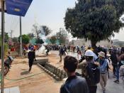 People flee to safety during an anti-coup protest in Loikaw