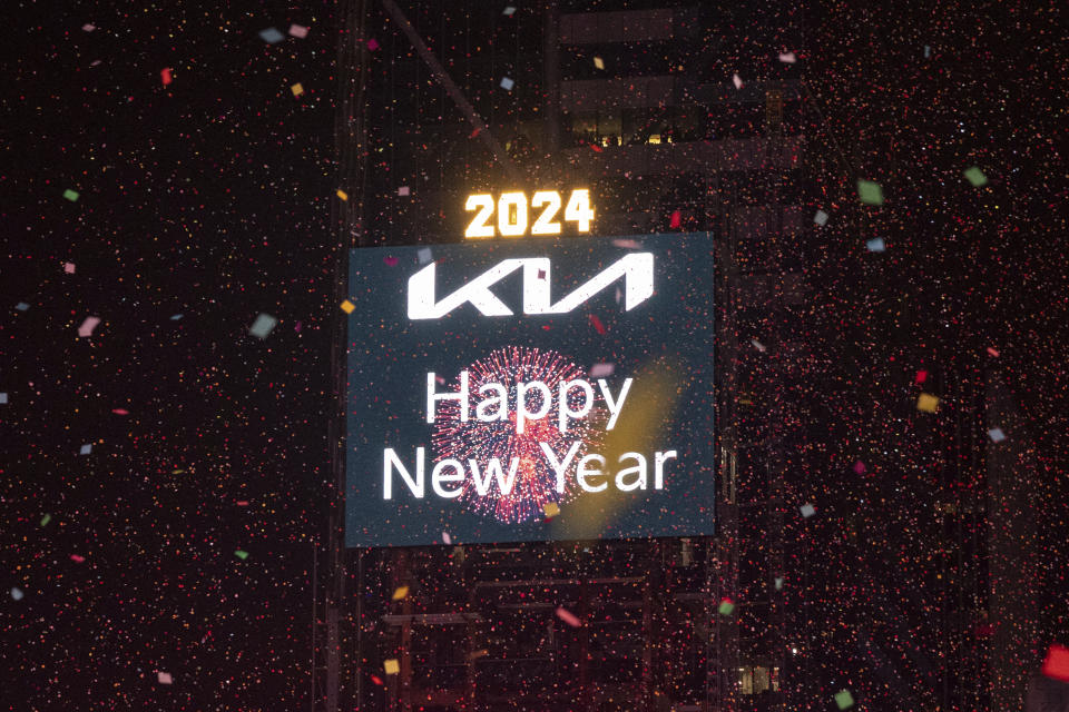 Confetti drops over the crowd as the clock strikes midnight as seen from the New York Marriott Marquis during the New Year's Eve celebration in Times Square, early Monday, Jan. 1, 2024, in New York. (AP Photo/Yuki Iwamura)