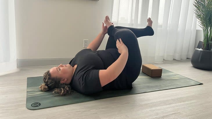 When practicing this common alternative to Pigeon Pose, you don’t need to interlace your hands behind your thigh. Rest them wherever you can. (Photo: Ellie Sheppard)