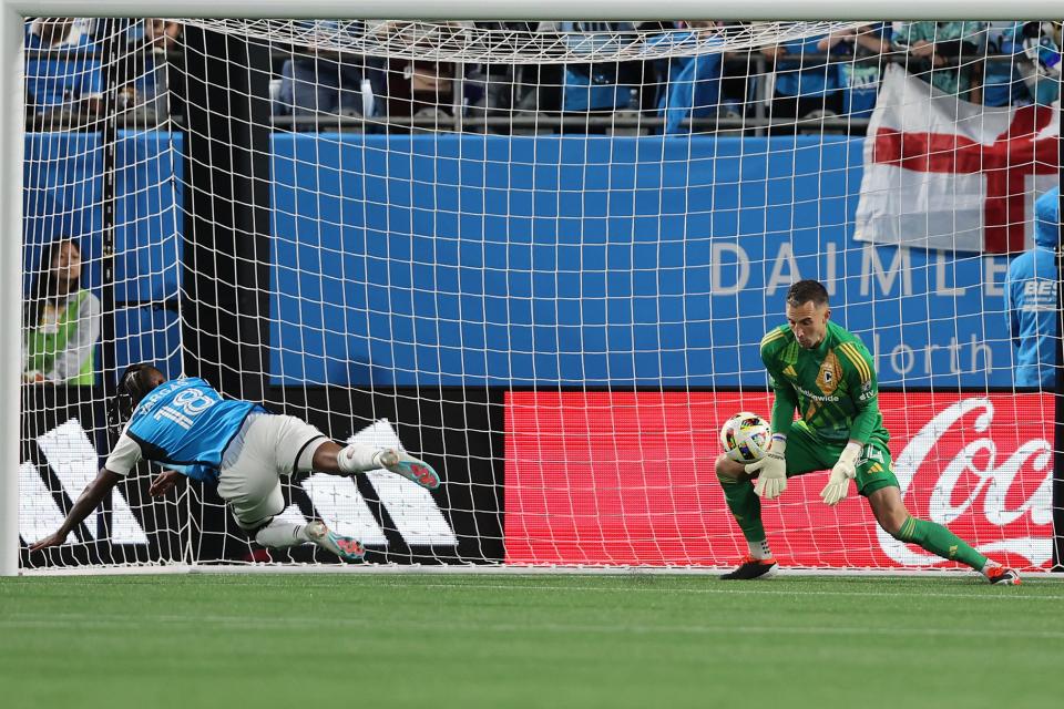 Mar 23, 2024; Charlotte, North Carolina, USA; Columbus Crew goalkeeper Evan Bush (24) makes a save against Charlotte FC forward Kerwin Vargas (18) at Bank of America Stadium. Mandatory Credit: Cory Knowlton-USA TODAY Sports