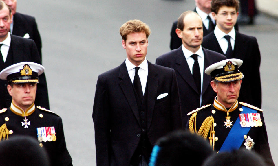 403541 12: Britain's Prince Charles (R) Prince Andrew (L) and Prince William (C) walk behind the Gun Carriage bearing the coffin of the Queen Mother April 9, 2002 as it makes its way to Westminster Abbey during her state funeral April 9, 2002 in London. (Photo by Anthony Harvey/Getty Images)