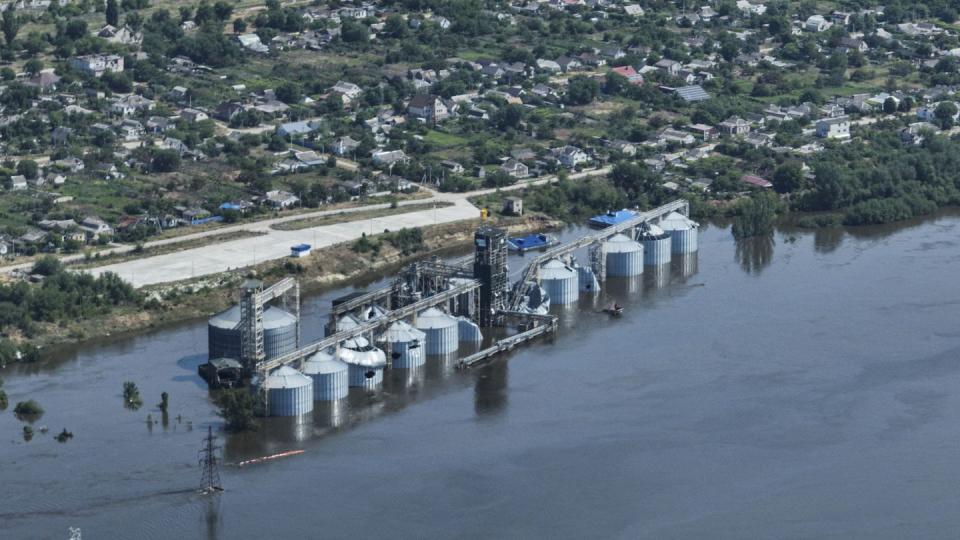 CAPTION CORRECTS LOCATION - Grain storage sits underwater after the collapse of the Kakhovka Dam, in Kozatske, in Russian-occupied Ukraine, Wednesday, June 7, 2023. (AP Photo)