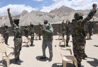India's PM Modi gestures as he interacts with army soldiers during his visit to Himalayan region of Ladakh