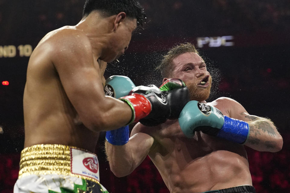 Jaime Munguia lands a left to Canelo Alvarez in a super middleweight title fight Saturday, May 4, 2024, in Las Vegas. (AP Photo/John Locher)