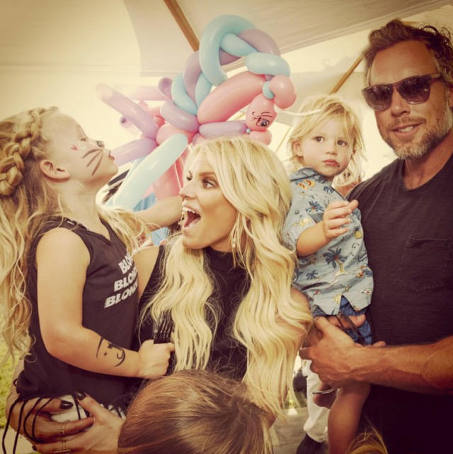 Jessica Simpson cosies up to her husband Eric Johnson in New York