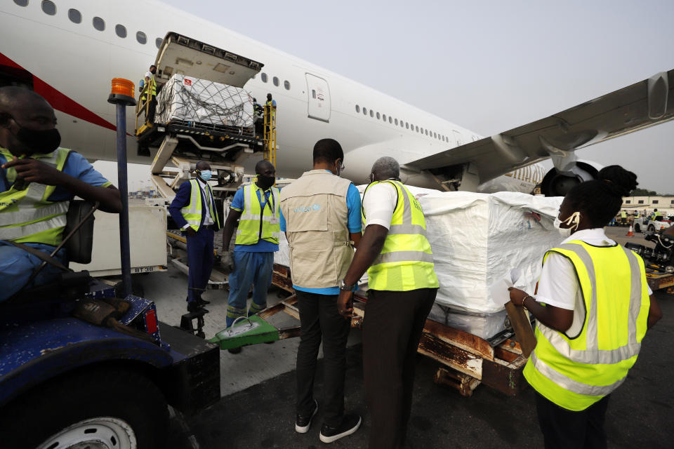 This photograph released by UNICEF Wednesday Feb. 24, 2021 shows the first shipment of COVID-19 vaccines distributed by the COVAX Facility arriving at the Kotoka International Airport in Accra, Ghana. Ghana has become the first country in the world to receive vaccines acquired through the United Nations-backed COVAX initiative with a delivery of 600,000 doses of the AstraZeneca vaccine made by the Serum Institute of India. (Francis Kokoroko/UNICEF via AP)