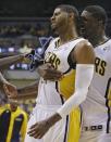 Indiana Pacers' Roy Hibbert, right, celebrates with Paul George after George hit a three-point shot at the end of the third quarter during Game 2 of an opening-round NBA basketball playoff series against the Atlanta Hawks Tuesday, April 22, 2014, in Indianapolis. Indiana defeated Atlanta 101-85. (AP Photo/Darron Cummings)