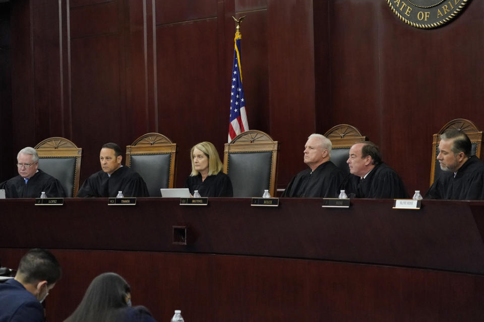 FILE – Arizona Supreme Court Justices from left; William G. Montgomery, John R Lopez IV, Vice Chief Justice Ann A. Scott Timmer, Chief Justice Robert M. Brutinel, Clint Bolick and James Beene listen to oral arguments on April 20, 2021, in Phoenix. The Arizona Supreme Court ruled Tuesday, April 9, 2024, that the state can enforce its long-dormant law criminalizing all abortions except when a mother’s life is at stake. (AP Photo/Matt York, File)