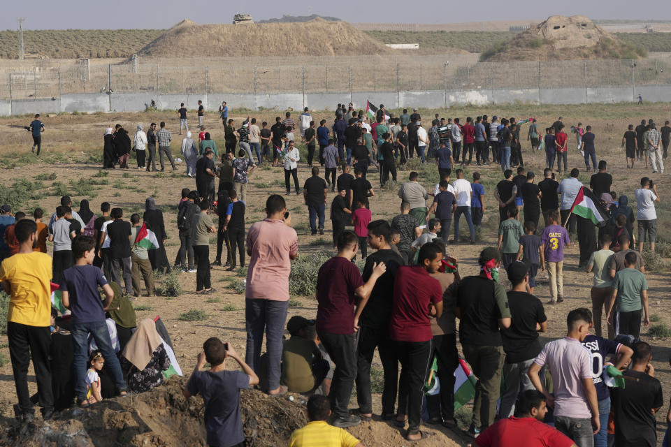 Palestinian protesters gather during clashes with Israeli troops, along the frontier with Israel, east of Gaza City, Monday, Aug. 21, 2023. Hundreds of Palestinians protested near the border fence with Israel. (AP Photo/Adel Hana)