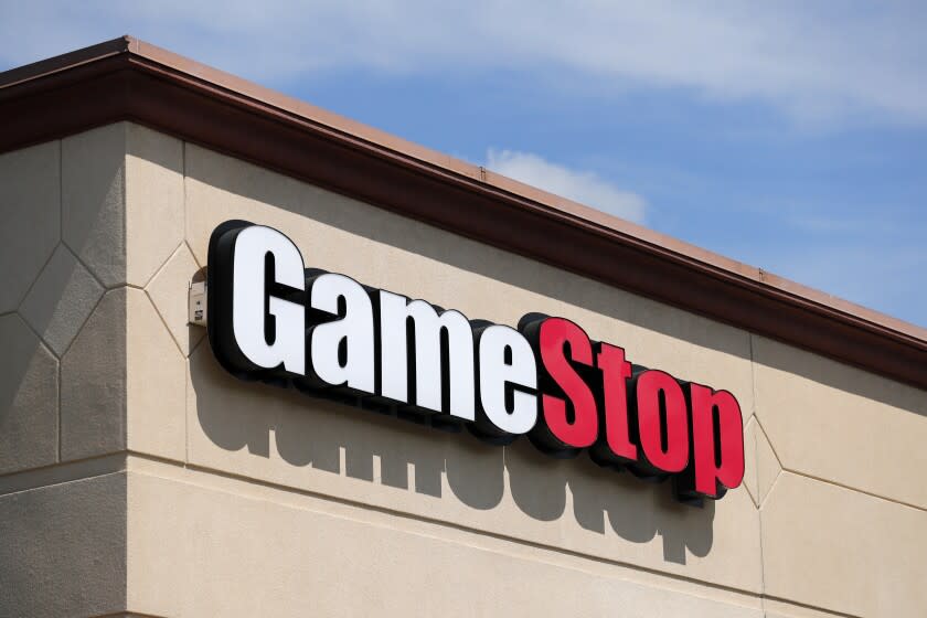 FILE - In this May 7, 2020 file photo, a GameStop store is seen in St. Louis. Two hedge funds are bowing out of their short positions on the money-losing video game retailer. Citron Research's Andrew Left said in a video posted on YouTube that his company is going to become more judicious in shorting stocks. Melvin Capital is also exiting GameStop, with manager Gabe Plotkin telling CNBC that the hedge fund was taking a significant loss. (AP Photo/Jeff Roberson, File)